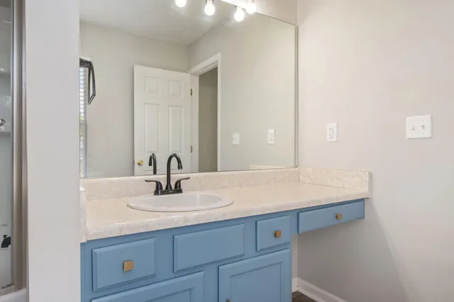 a bathroom with a sink and a mirror
