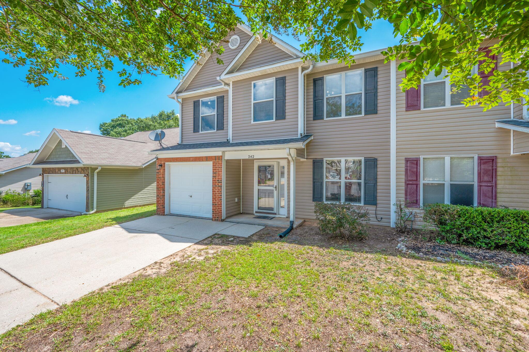 242 Wainwright Drive Crestview, FL 32539 - Photo 3 of 43 a front view of a house with a yard and garage