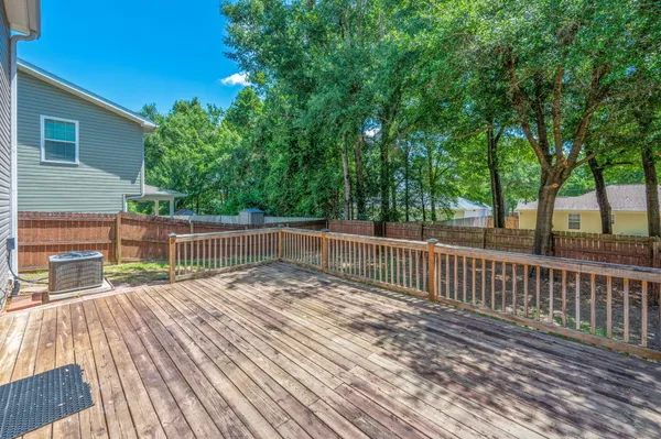 a view of deck with wooden floor and fence