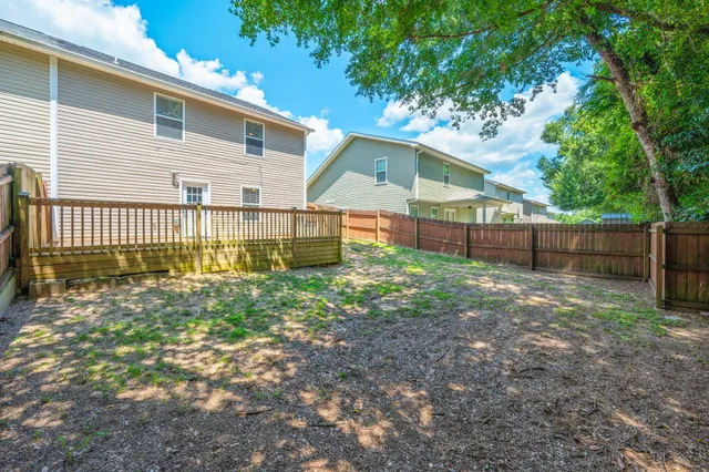 a view of a backyard with a small cabin and chair