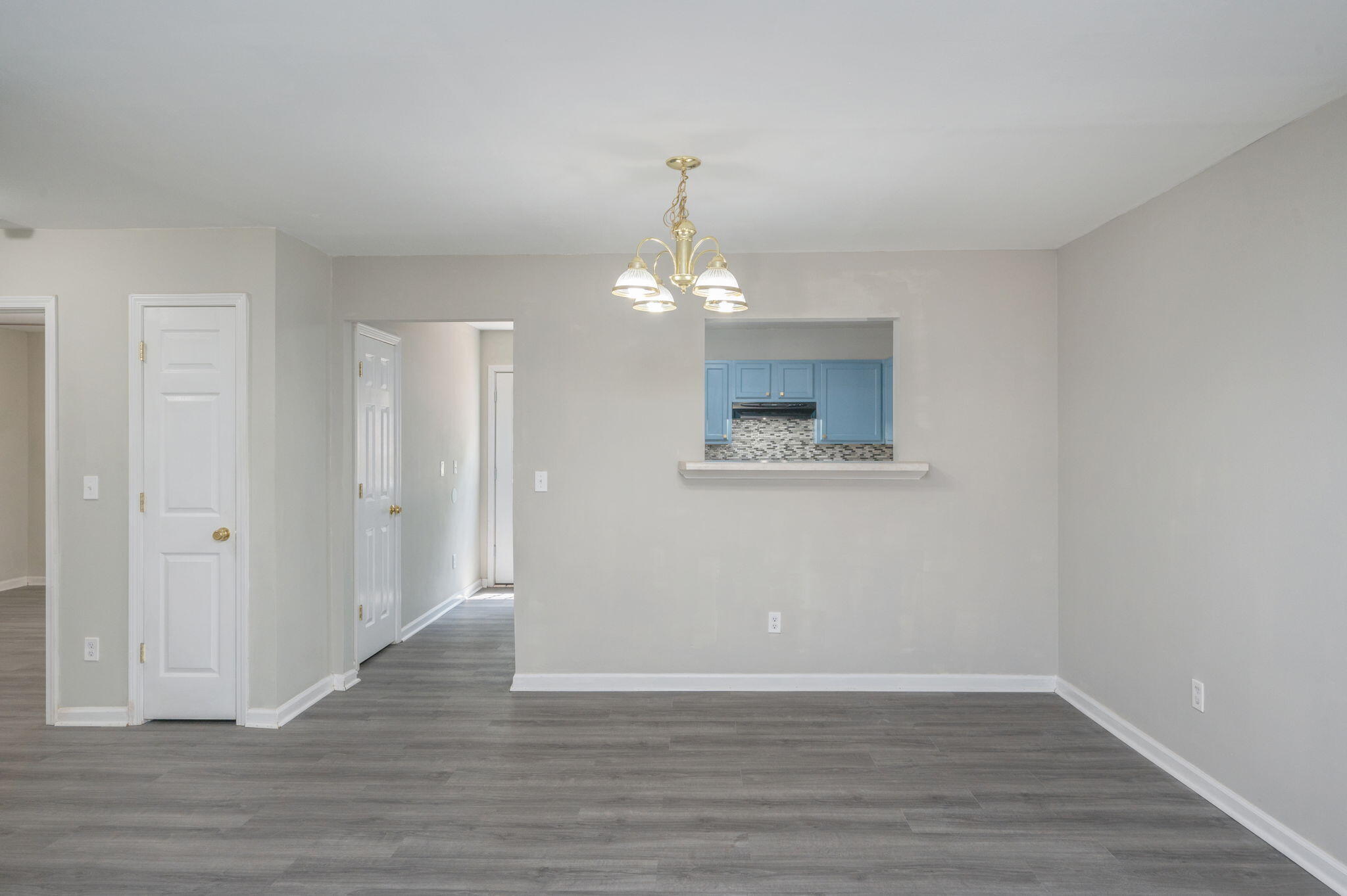 242 Wainwright Drive Crestview, FL 32539 - Photo 10 of 43 a view of an empty room with wooden floor and a window