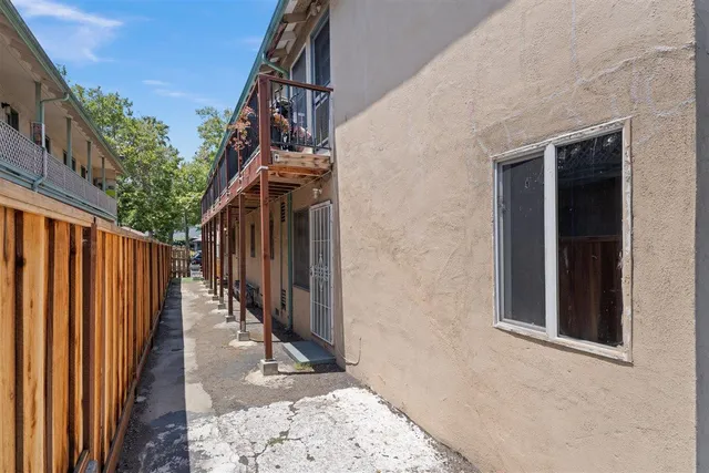a view of roof deck with chair and front door