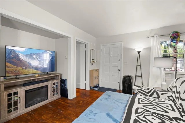 a bedroom with a bed and a table in it