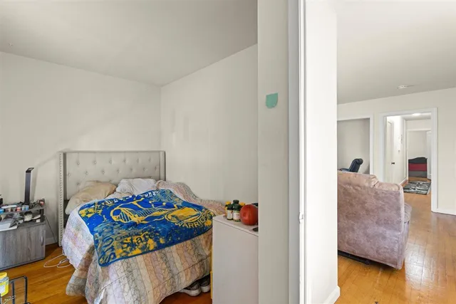 a bedroom with a bed and a dresser