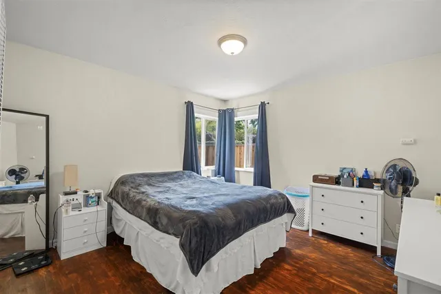 a bedroom with a bed and a view of bedroom