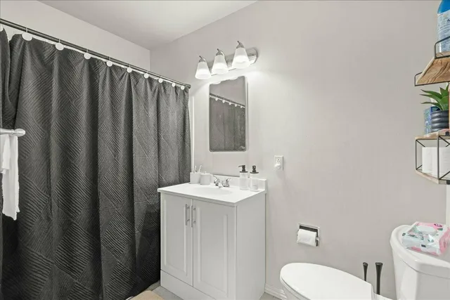 a bathroom with a glass shower door