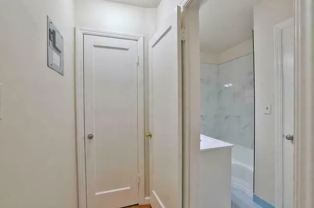 a bedroom with a bed and a closet