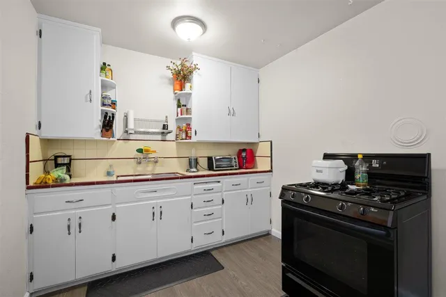 a kitchen that has a sink and a stove