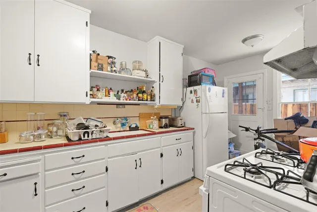 a kitchen with a stove and a microwave