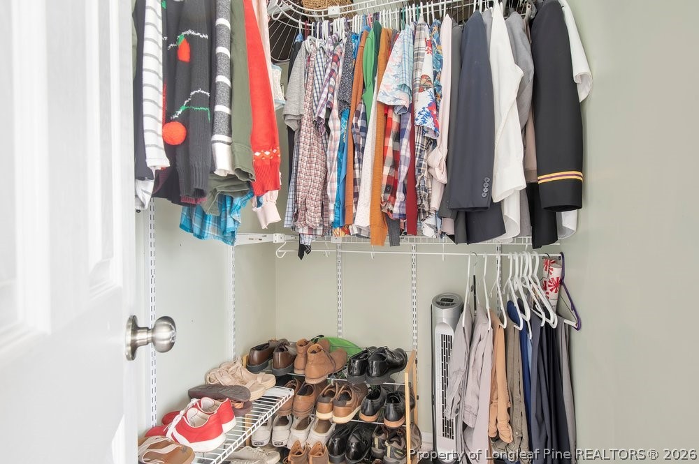 419 Senter Lane Bunnlevel, NC 28323 - Photo 22 of 49 a view of walk in closet with clothes and shoes