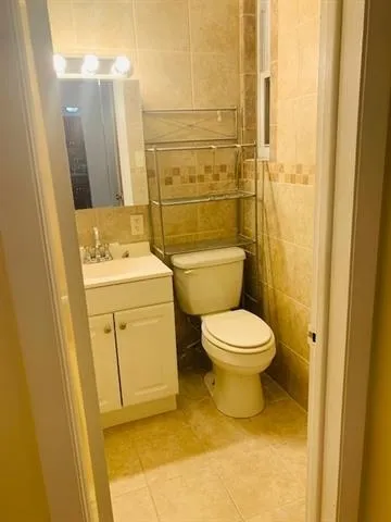 a bathroom with a toilet and a sink