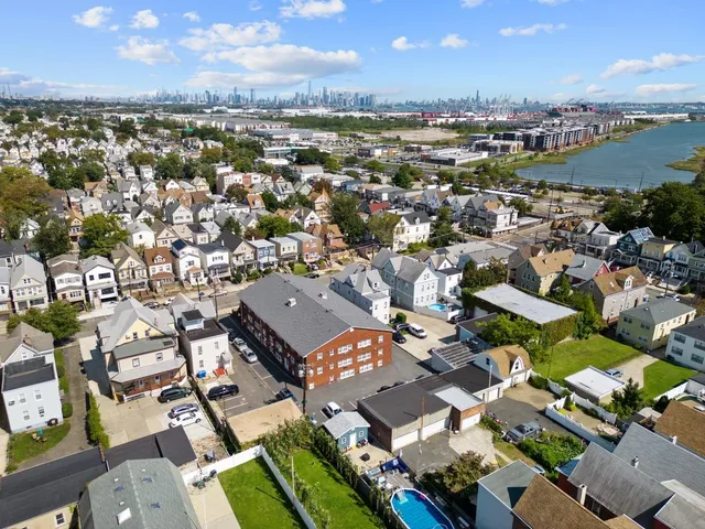 an aerial view of a city with lots of residential buildings