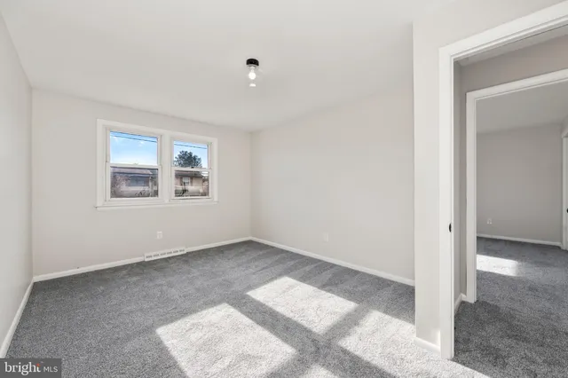 an empty room with windows