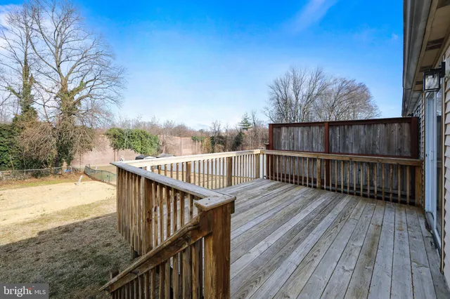 a view of deck with wooden floor and fence