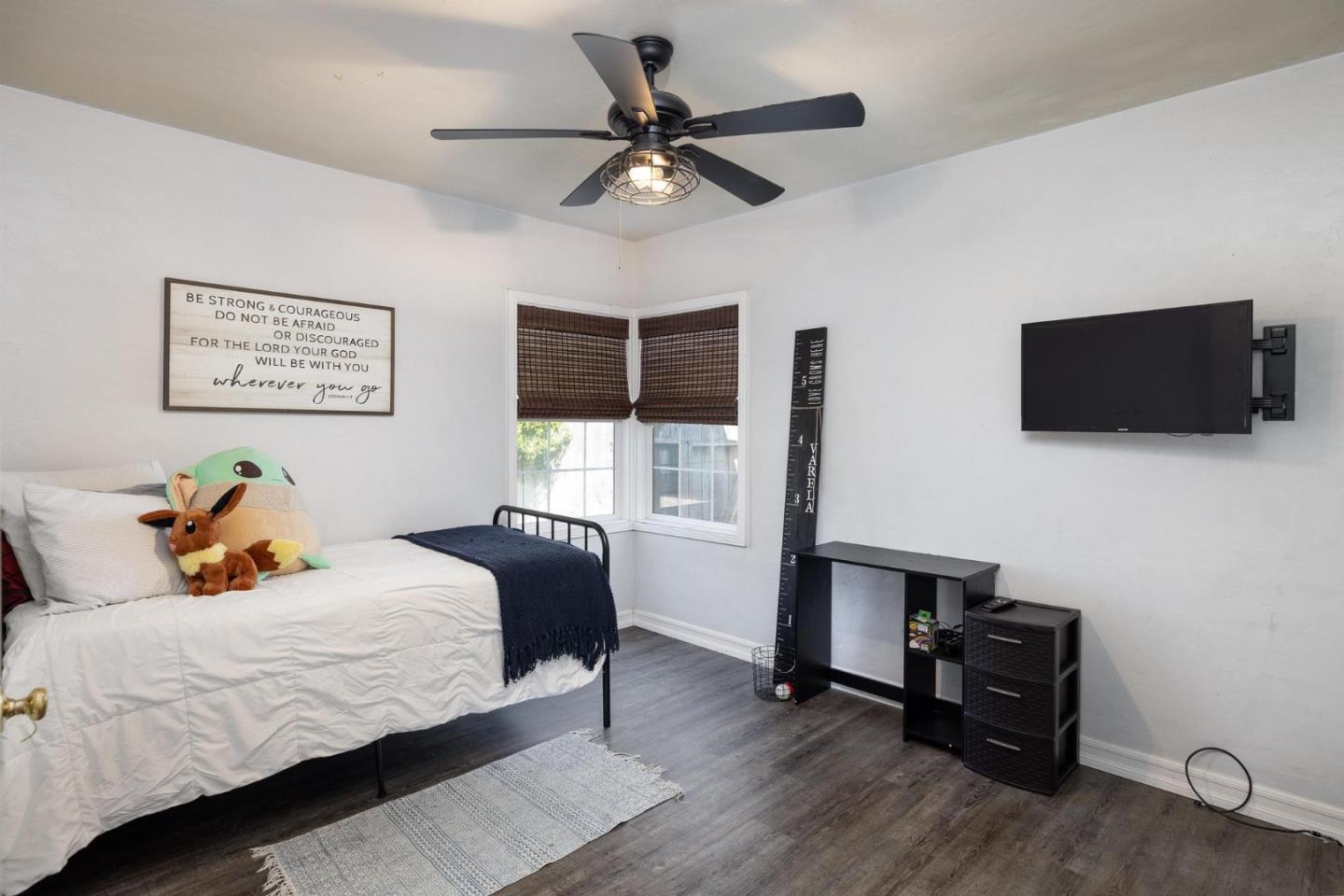 17 North 3rd Street Salinas, CA 93906 - Photo 10 of 13 a bedroom with a bed and a flat screen tv
