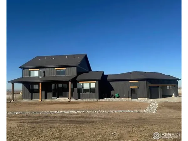 a front view of a house with a ocean view