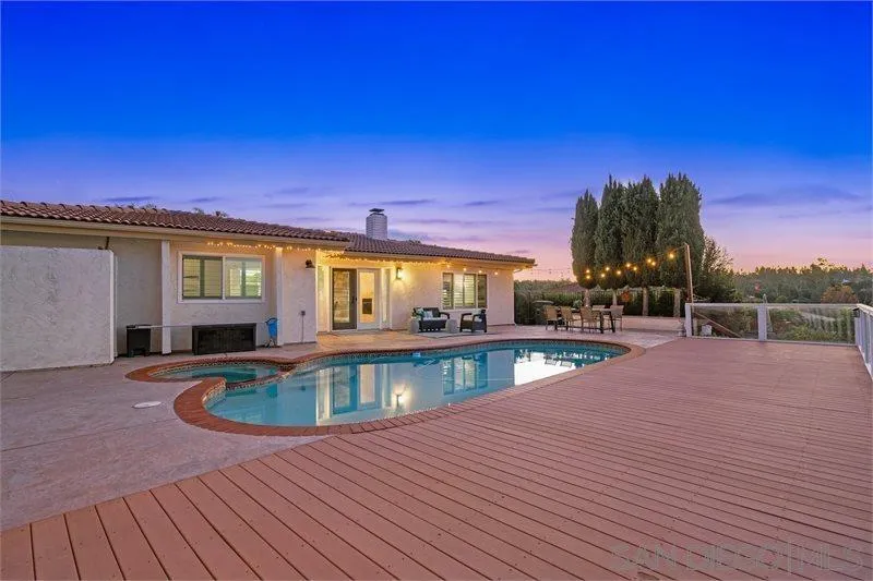 12720 Pedriza Road Poway, CA 92064 - Photo 3 of 26 a view of a house with swimming pool