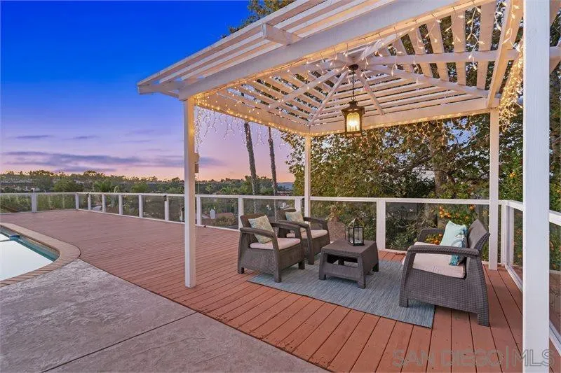 12720 Pedriza Road Poway, CA 92064 - Photo 6 of 26 a view of a roof deck with couches and wooden floor