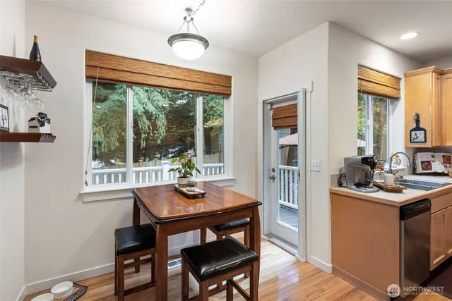 a living room with furniture and a view of kitchen