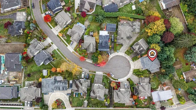 a kitchen with a sink a counter top space stainless steel appliances and cabinets