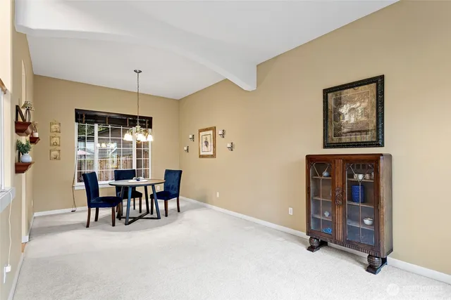 an empty room with floor to ceiling window and an empty room