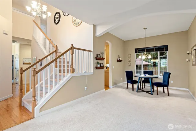 a dining room with furniture and window