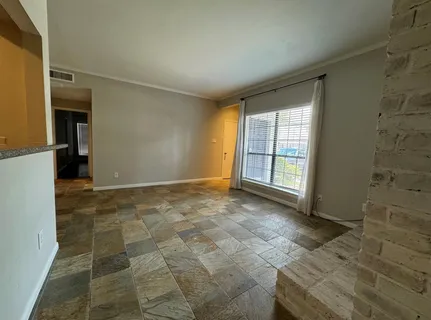 a view of an empty room and window