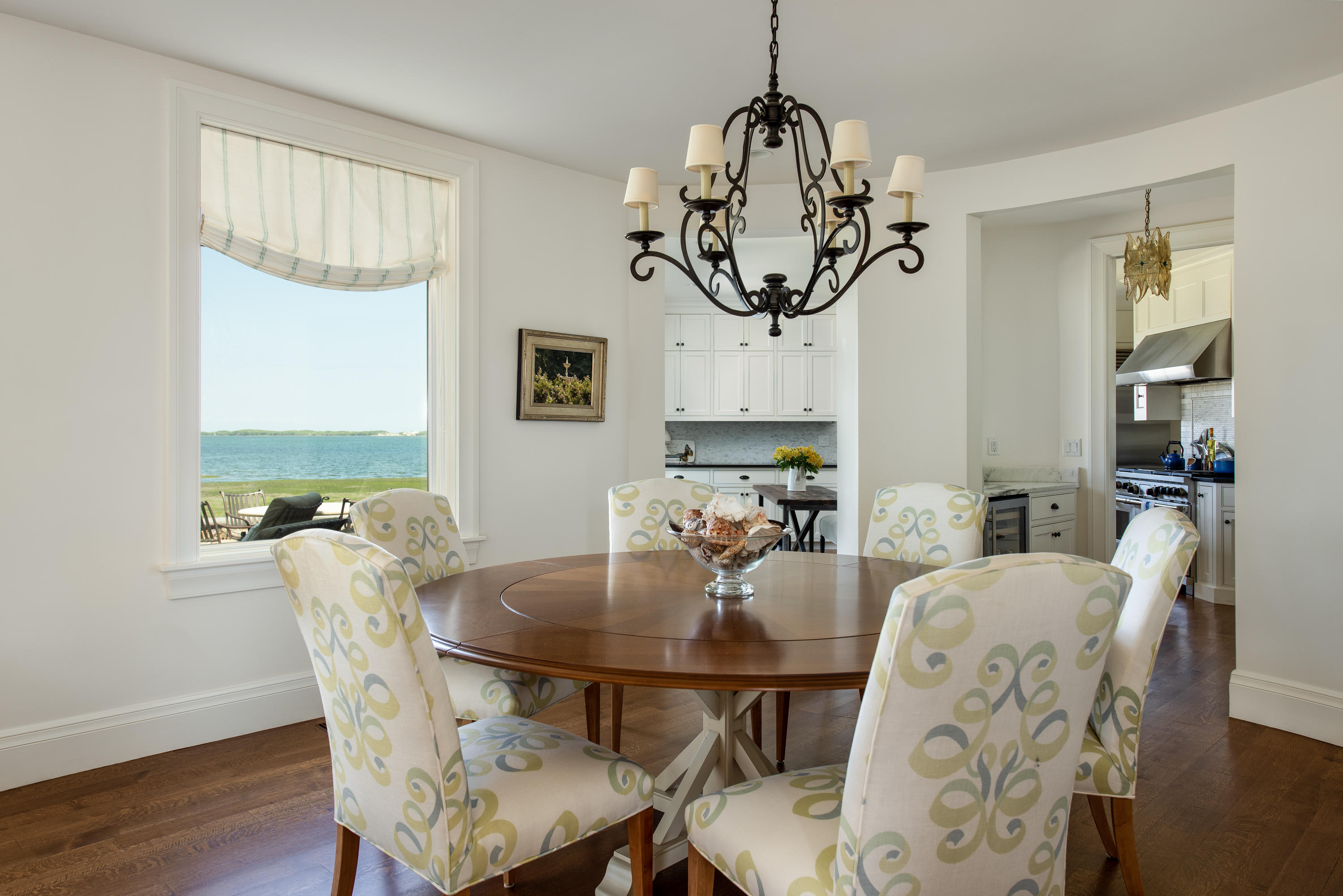 85 Salten Point Road Barnstable, MA 02630 - Photo 11 of 34 a view of a dining room with furniture window and wooden floor