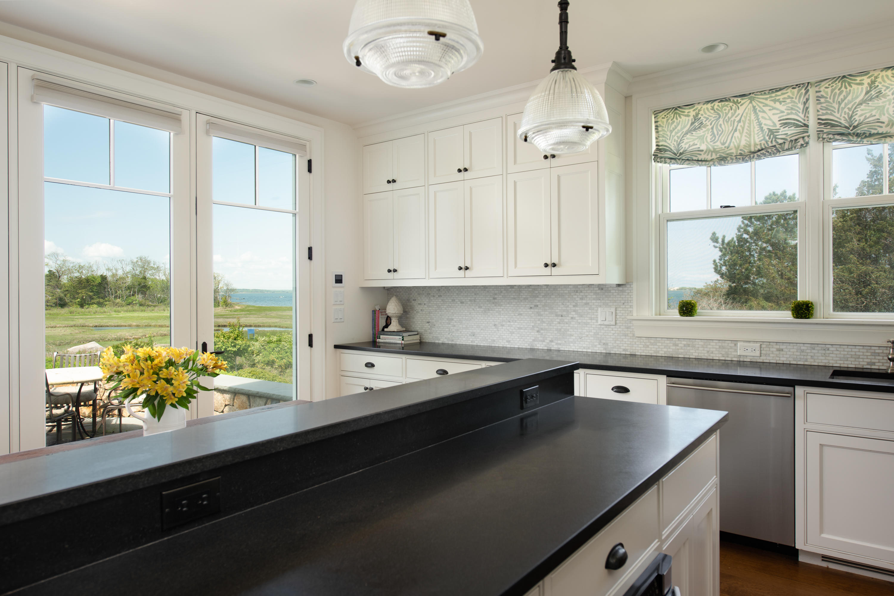 85 Salten Point Road Barnstable, MA 02630 - Photo 12 of 34 a kitchen with a sink a large window and appliances