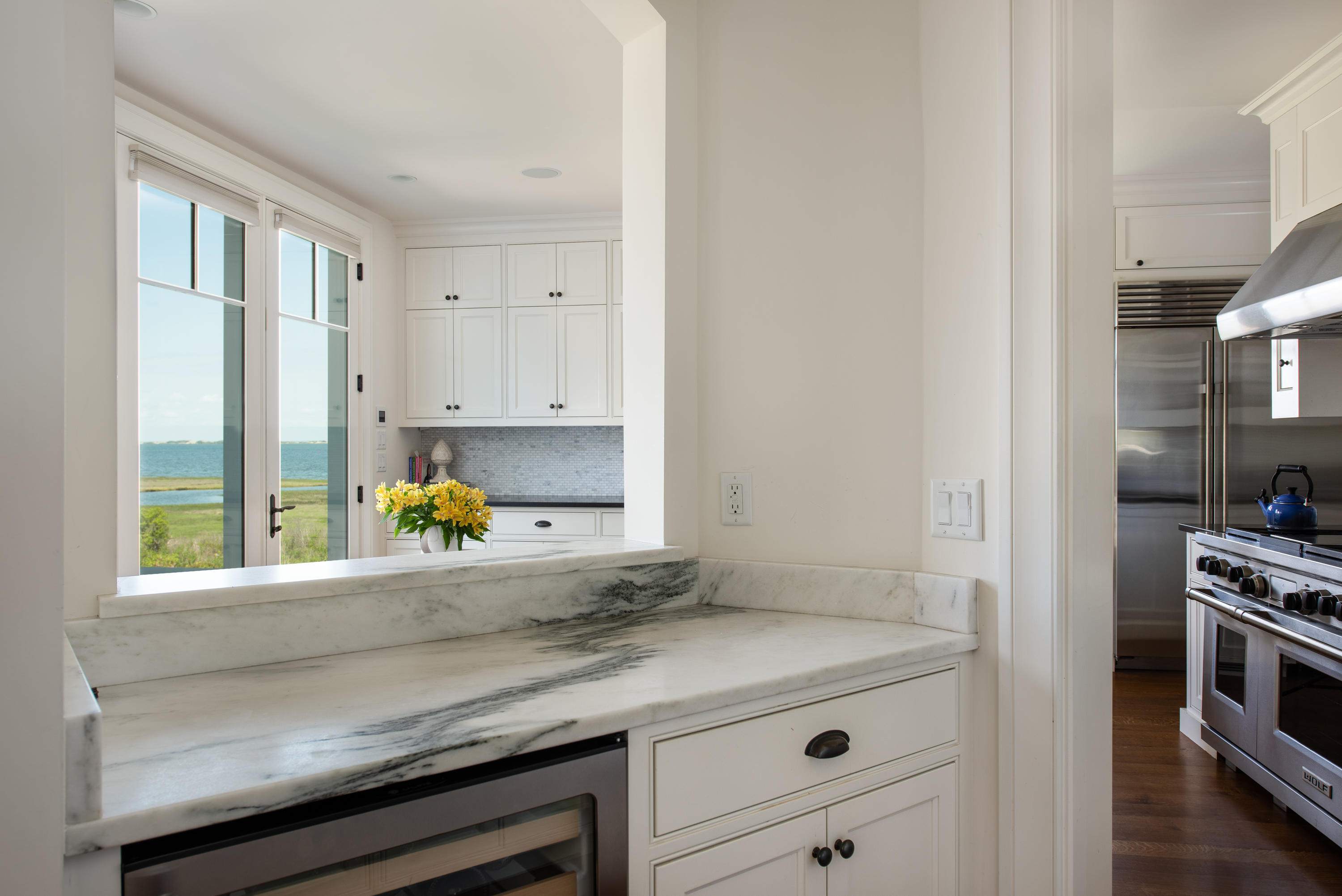 85 Salten Point Road Barnstable, MA 02630 - Photo 13 of 34 a kitchen with a sink a stove and cabinets