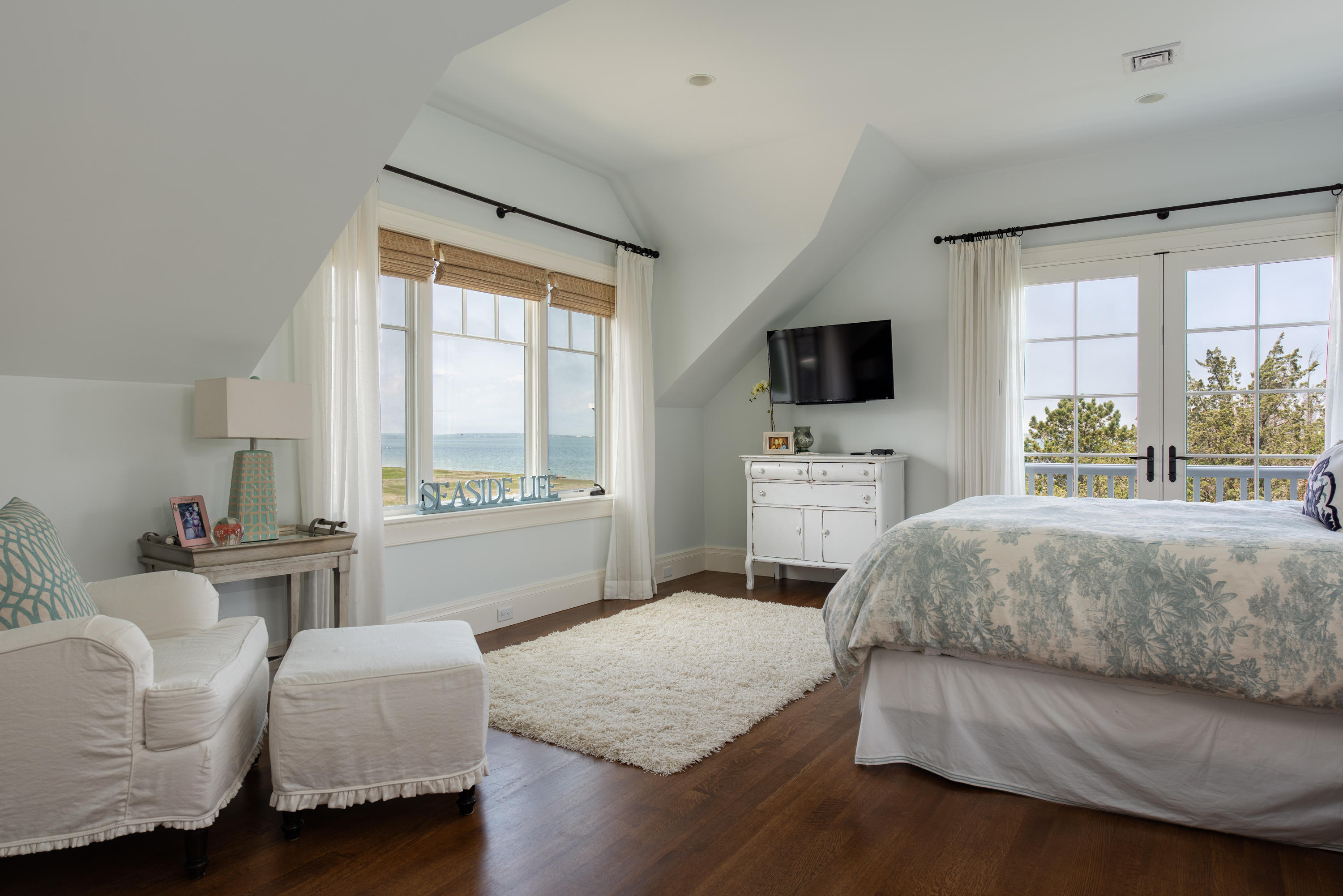 85 Salten Point Road Barnstable, MA 02630 - Photo 26 of 34 a bedroom with a bed and a flat screen tv