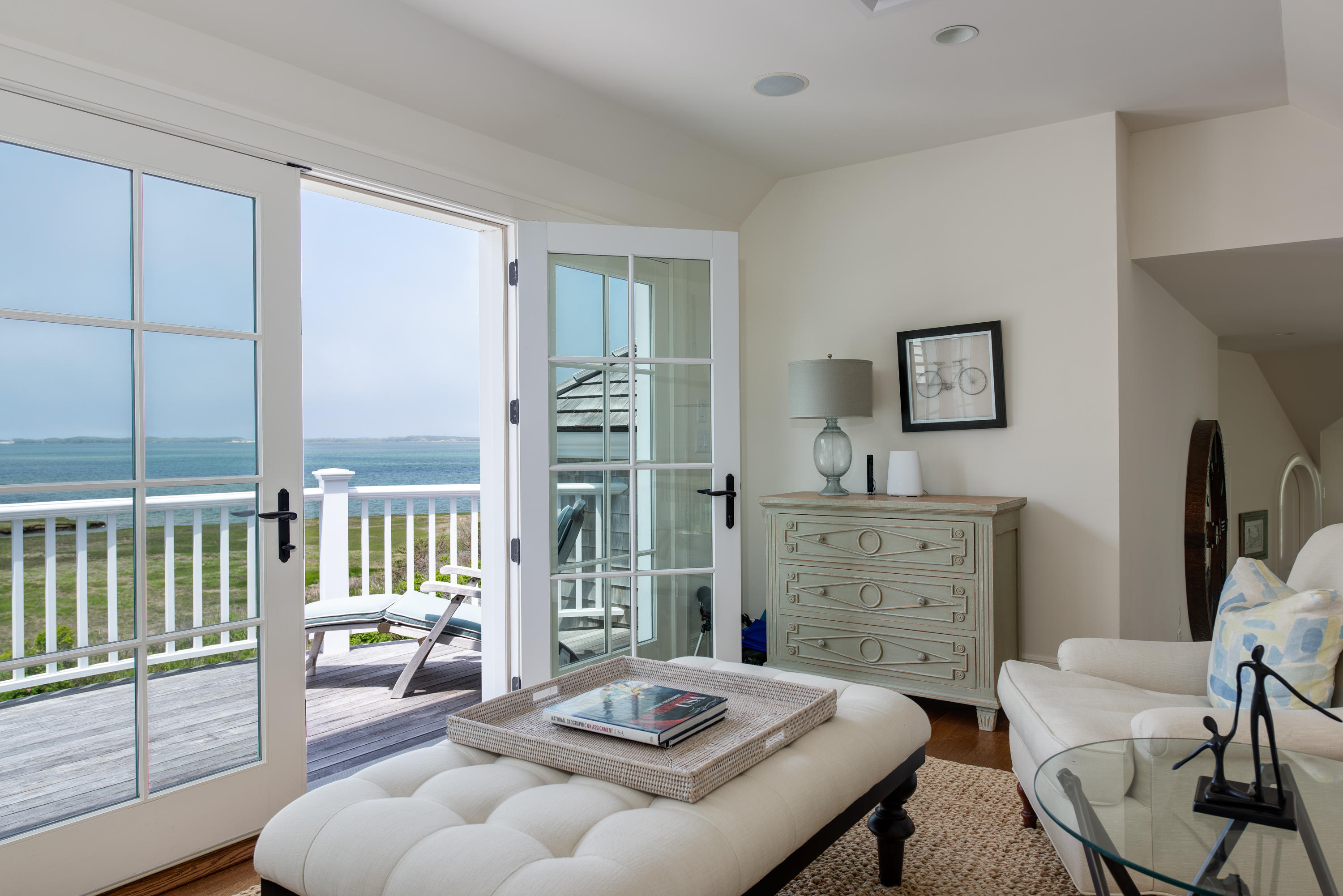 85 Salten Point Road Barnstable, MA 02630 - Photo 29 of 34 a living room with furniture and a floor to ceiling window