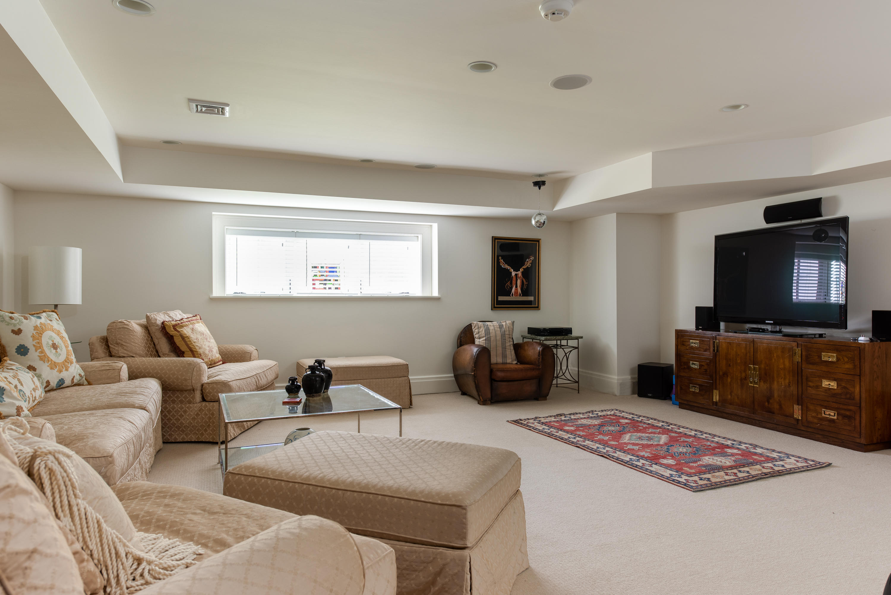 85 Salten Point Road Barnstable, MA 02630 - Photo 30 of 34 a living room with furniture a flat screen tv and kitchen view