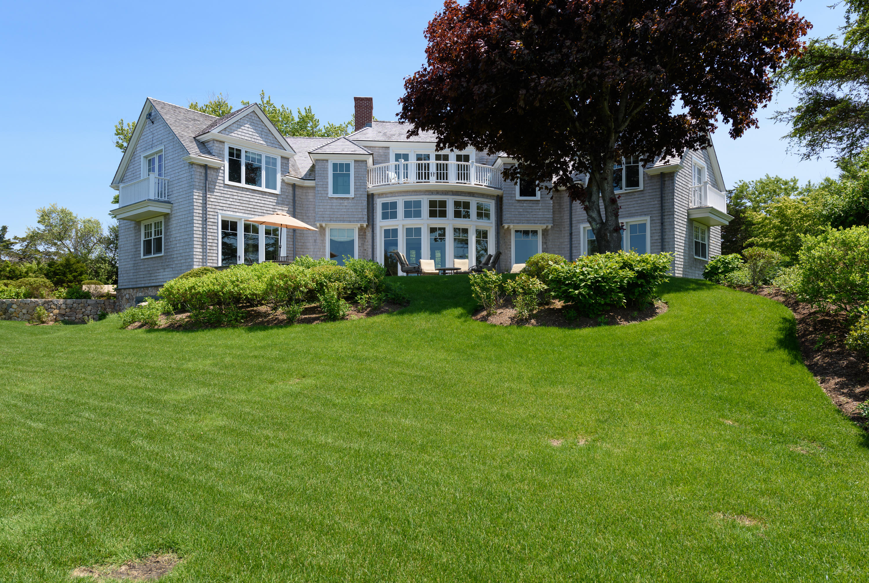 85 Salten Point Road Barnstable, MA 02630 - Photo 4 of 34 a front view of a house with a garden