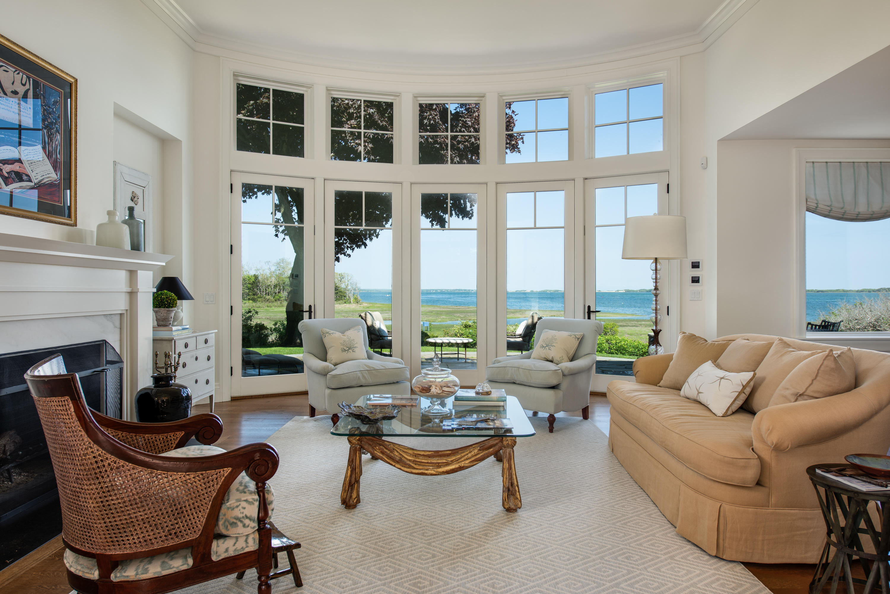 85 Salten Point Road Barnstable, MA 02630 - Photo 7 of 34 a living room with fireplace furniture and a large window