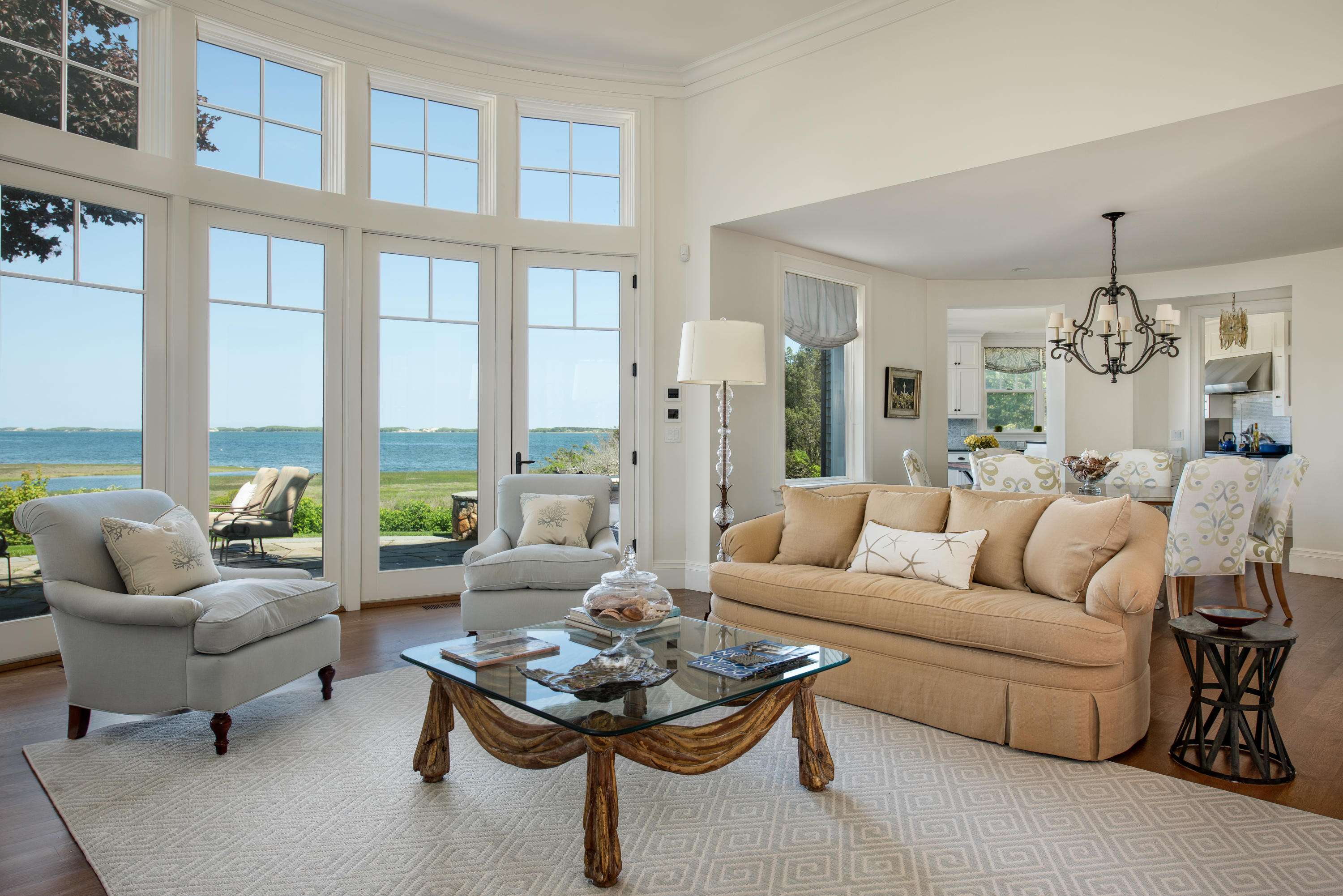 85 Salten Point Road Barnstable, MA 02630 - Photo 8 of 34 a living room with furniture potted plant and large windows