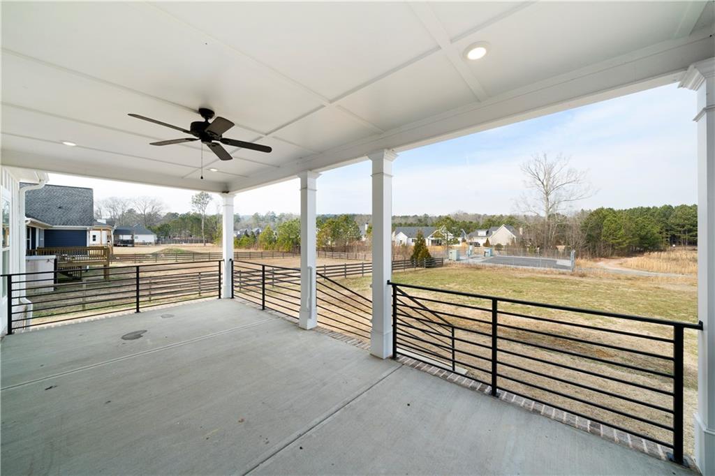 19 Trotters Lane Rome, GA 30165 - Photo 11 of 44 an empty room with wooden floor fan and windows