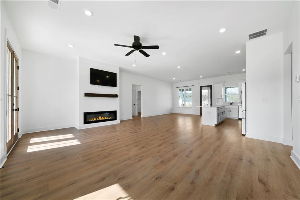 19 Trotters Lane Rome, GA 30165 - Photo 16 of 44 a view of empty room with wooden floor and fireplace