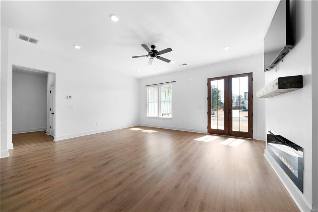 19 Trotters Lane Rome, GA 30165 - Photo 17 of 44 an empty room with wooden floor and windows