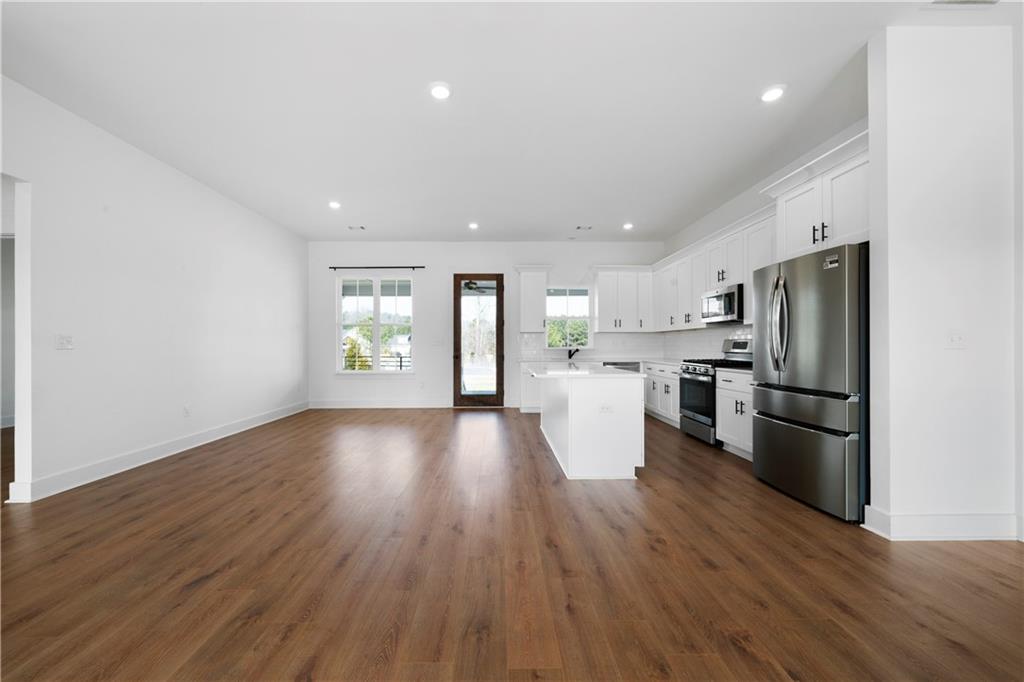 19 Trotters Lane Rome, GA 30165 - Photo 20 of 44 a view of kitchen view wooden floor stainless steel appliances and cabinets