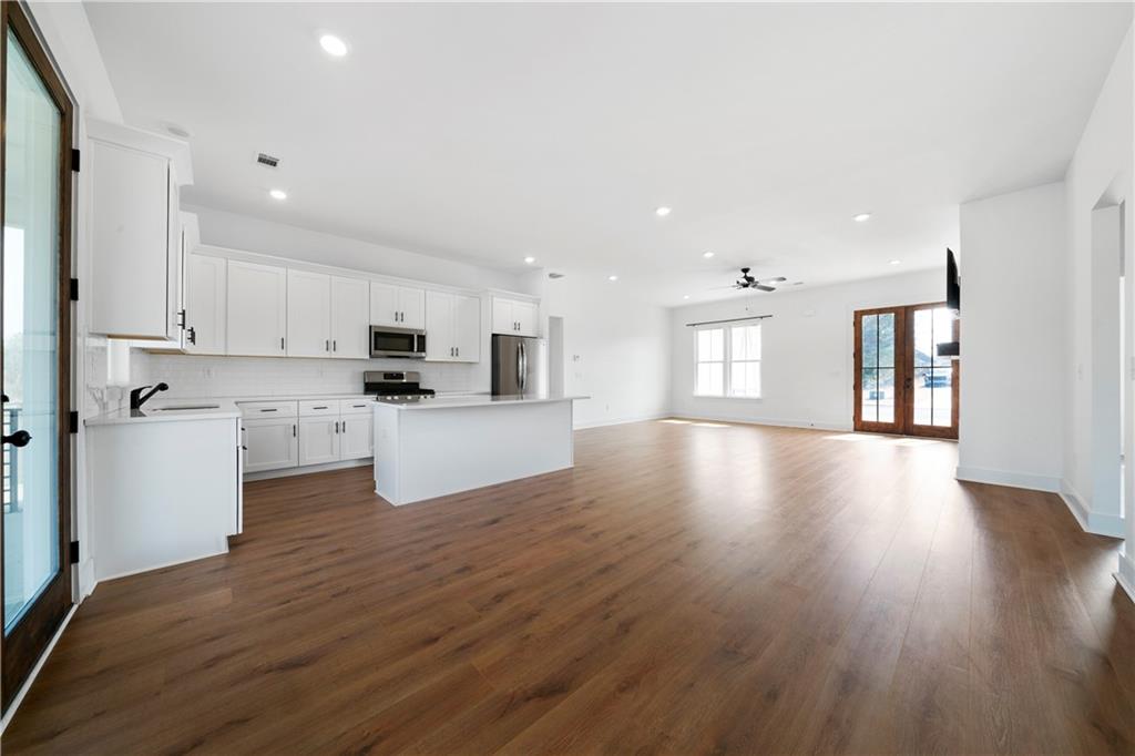 19 Trotters Lane Rome, GA 30165 - Photo 22 of 44 a view of kitchen with granite countertop stainless steel appliances refrigerator sink and cabinets