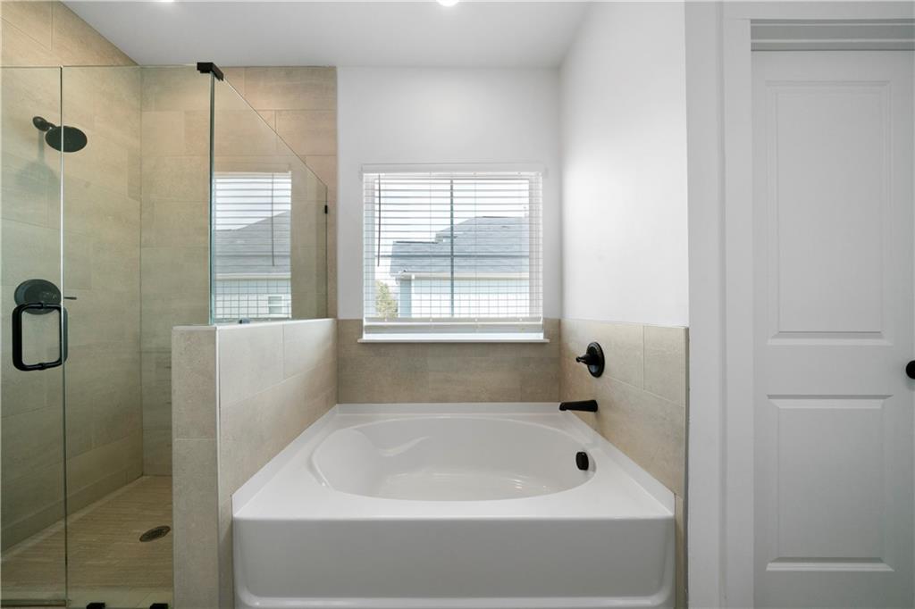 19 Trotters Lane Rome, GA 30165 - Photo 34 of 44 a bathroom with a bath tub and shower