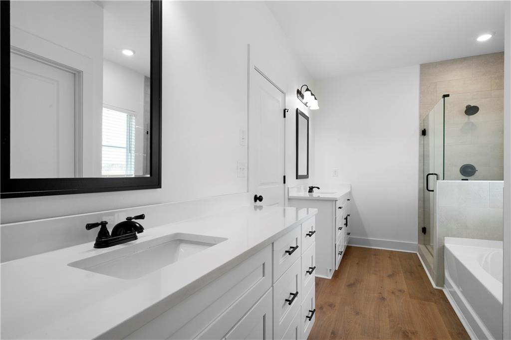 19 Trotters Lane Rome, GA 30165 - Photo 36 of 44 a bathroom with a double vanity sink mirror and bathtub