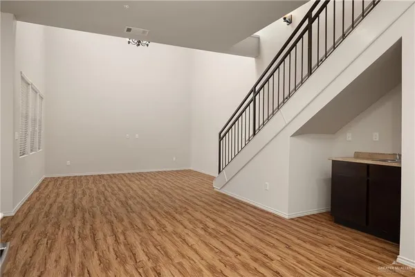 a view of kitchen with furniture and wooden floor