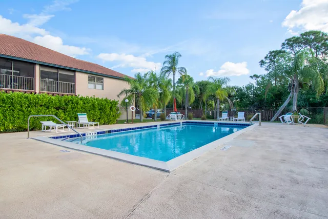 a view of a swimming pool with a patio