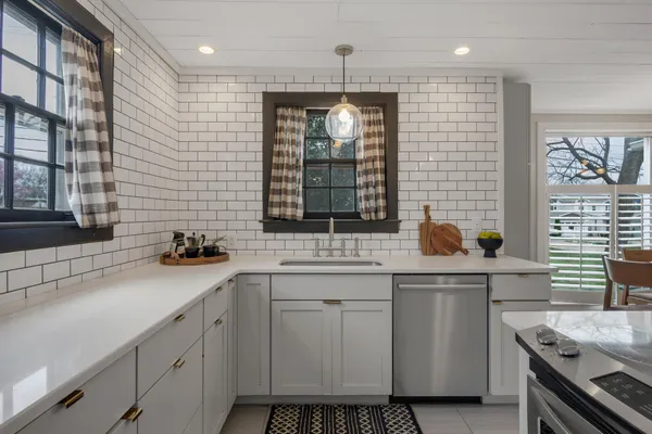 a kitchen with a sink and cabinets