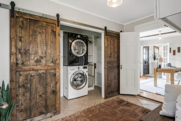 a view of a storage & utility room with a window