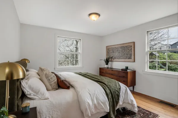 a bedroom with a bed and a window