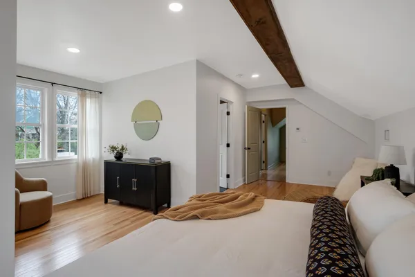 a bedroom with a bed and a dresser