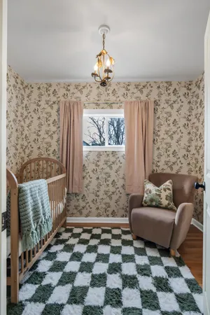 a living room with a couch and a rug